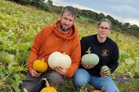Thomas Brown and his partner Lauren Adams making preparations for the 2023 grand opening at Oxford Farm Pumpkin Patch.