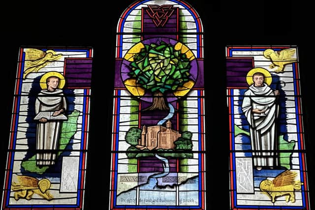 The millennium window, incorporating a drawing of the church by Susan Hughes.
