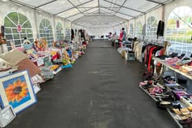 SUEZ marquee with reuse items for sale.