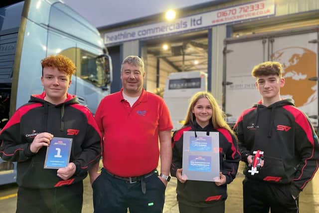Team Scuderia Velocita members George, Ruby, and Benjamin with Heathline Commercials' Gavin Cape. (Photo by Heathline Commercials)