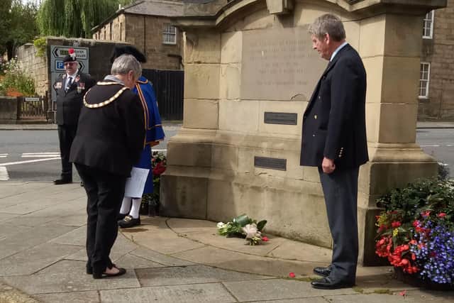 Mayor of Alnwick Lynda Wearn lays flowers at the war memorial to mark the 75th anniversary of VJ Day.