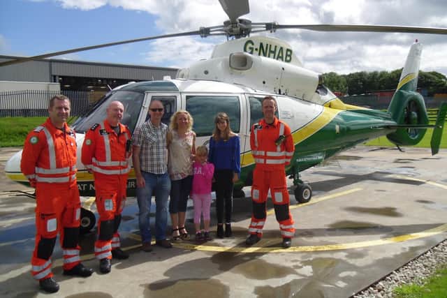 Zoe Neasham and family with Owen McTeggart, Terry Sharpe and Dr Jeff Doran from the Great North Air Ambulance Service.