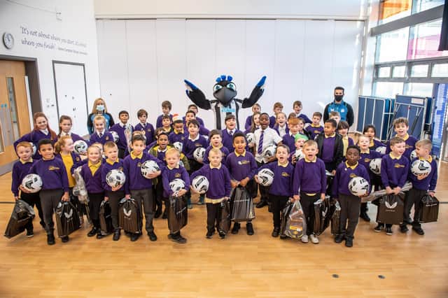 Newcastle United Foundation staff and mascot Monty Magpie deliver Christmas packs and sports equipment to pupils.