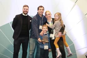 Adrian and Amanda Wooldridge, with their children, Thomas and Alice, and Chris Workman from The Gift Association celebrating Squelch's success at the 'Gift of the Year 2020' Awards.