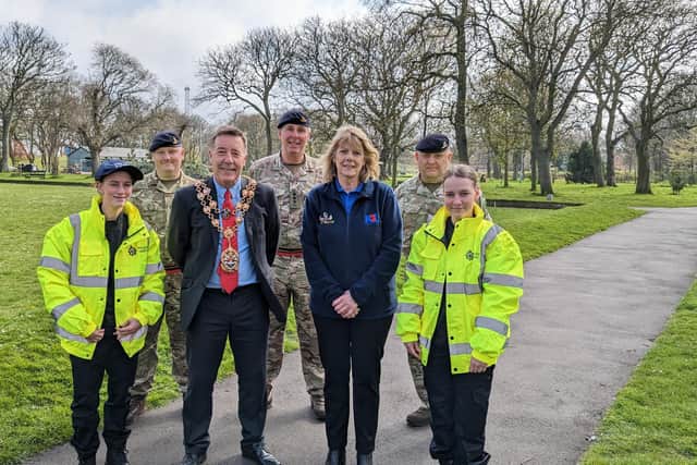 In the back row, Bombardier Mark Smith, Captain Graham Donkin, and Sergeant Andy Robbins with, in front, mini police cadets Brooke Dodds and Summer Dodds, Mayor Warren Taylor, and Gail Armstrong from the Royal British Legion.