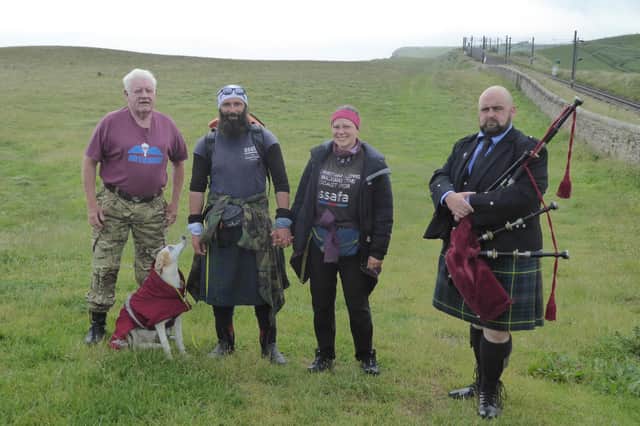 Chris Lewis, Kate and Jet with fellow paratrooper Alan Hughes, left, and piper Jamie Starr, right, on Sunday. Picture by Susan Hughes.