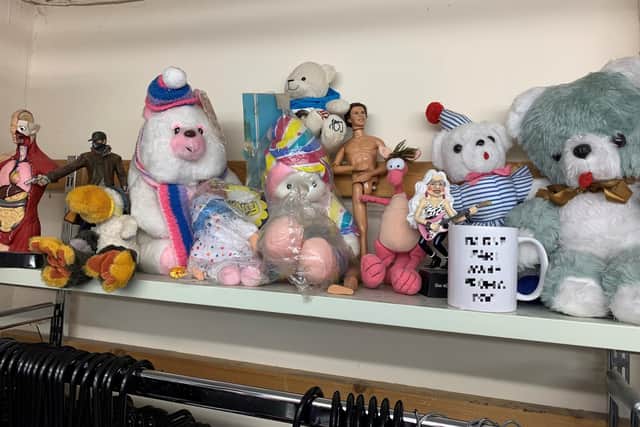 A shelf full of weird and wonderful donations to Alnwick Mind.
