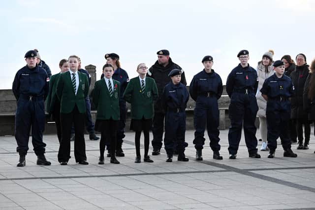 The academy’s sea cadets joined the service in their uniforms. (Photo by Barry Pells)