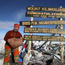 Ken Dunn at the summit of Mt Kilimanjaro.