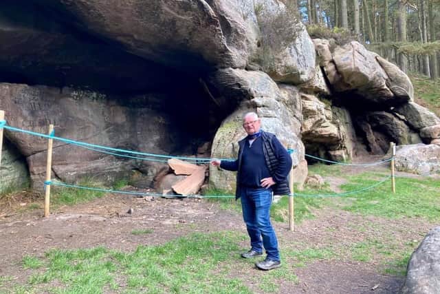 Cllr Colin Hardy at St Cuthbert's Cave, which has been roped off due to vandalism.