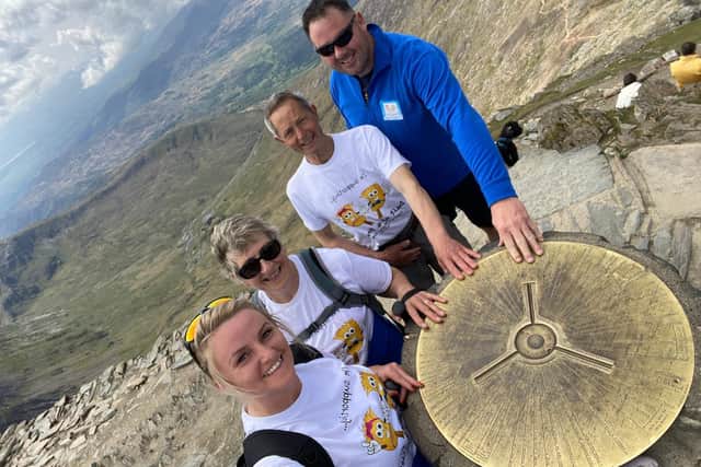 Laura King, Doreen Pringle, Peter Pringle and David King at the summit of Snowdon in Wales.