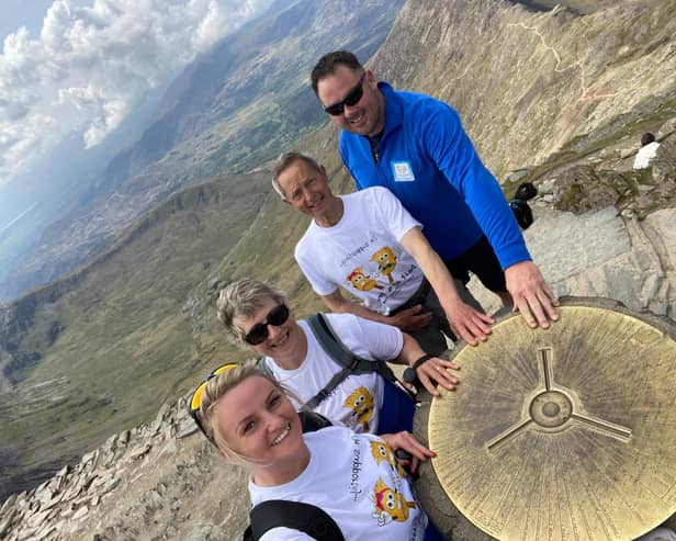 Laura King, Doreen Pringle, Peter Pringle and David King at the summit of Snowdon in Wales.