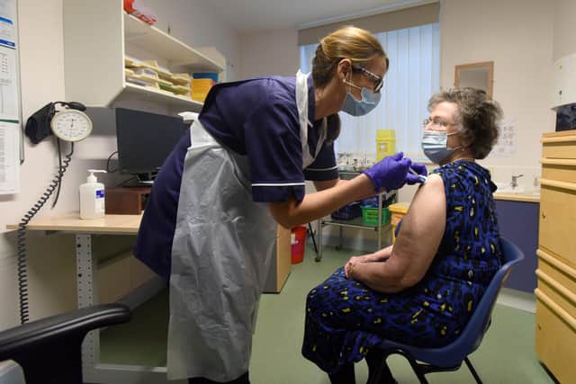 Lintonville Surgery in Ashington which is one of the first in the NHS Northumbria area to vaccinate people at the GP level. Pictured is pensioner Jean Jones aged  84 with nurse Leslie Williamson