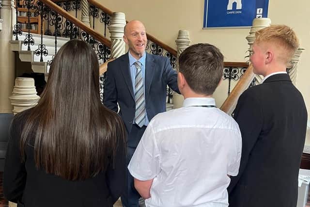 Mr Wilcox with a group of students.