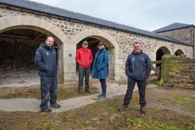 Chris Jones and Tony Gates with Ross and Rebecca Wilson (centre) at one of the historical buildings restored on Ingram Valley Farm in conjunction with Northumberland National Park.