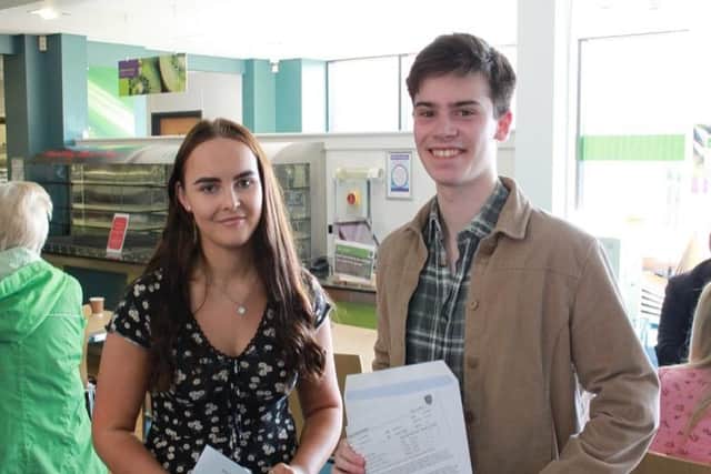 Alice Holman and Jack Mace with their A-Levels.