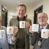 Councillors Lynda Wearn, Gordon Castle and Mayor Geoff Watson with the commemorative mugs. Picture: Alnwick Town Council