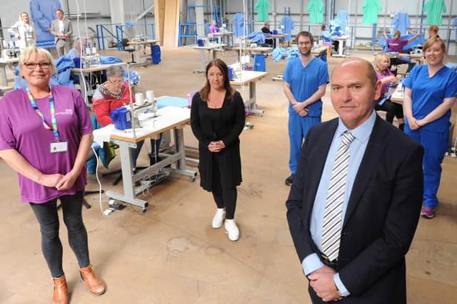 Volunteer Dawn Shiel, Lucas Jacob Ltd MD Sarah Rose, Northumbria critical care nurse Paul Moss, Northumbria Healthcare chief executive Sir James Mackey and critical care nurse Amy Nielsen at the opening of the new protective gowns manufacturing and distribution hub.