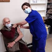 Retired doctor James Mitchell was first to get a Covid vaccine at Well Close Surgery in Berwick.