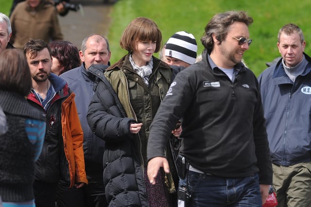 Nicole Kidman leaves after signing autographs between scenes.
