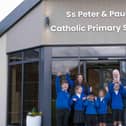Ss Peter and Paul's Catholic Primary School celebrates the completed project. (Photo by Kate Buckingham)