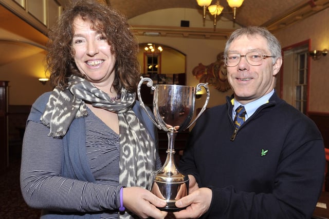 Sue Skirrow accepts her Coach Of The Year trophy from David Young of alnorthumbria vetinary group.