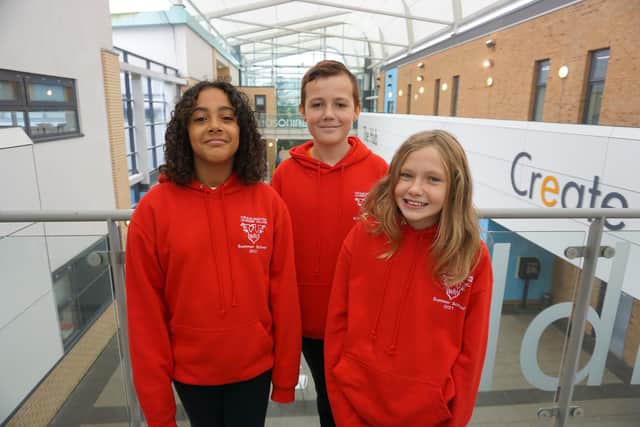 Janoma and Layla from Burnside Primary School with Kieron from Beacon Hill Primary School take a look around Cramlington Junior Learning Village.
