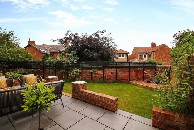 The side garden has been landscaped with a large patio for alfresco entertaining with further patio area to the rear.