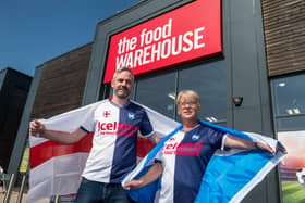 Staff from the Food Warehouse in Berwick in their half and half shirts.