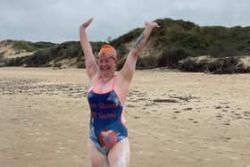 Gill Castle celebrates completing her Channel swim.