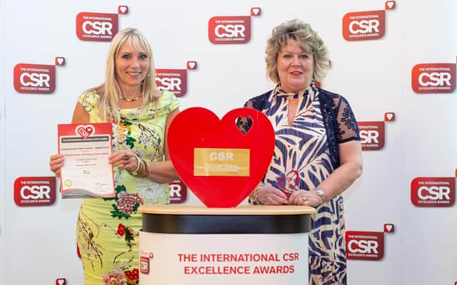 Cllr Helen Morris (right) and Maggie Martin with the award.