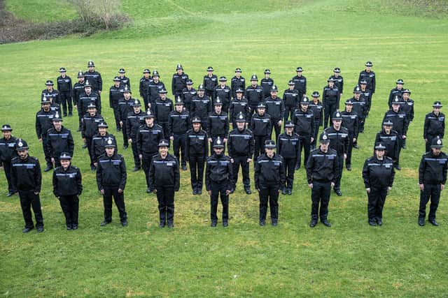 The new recruits wearing their uniform for the first time.