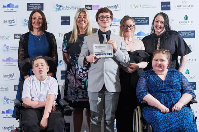 Sponsors (back row) in blue dress Lyn Wilkinson and next to her Helen Scorer from Pure Panel Management with members of Northumberland Disability Youth Forum.
