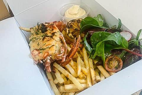 Poached and Grilled Half Lobster with Lobster Gratin, Skinny Fries and Truffle Mayo.