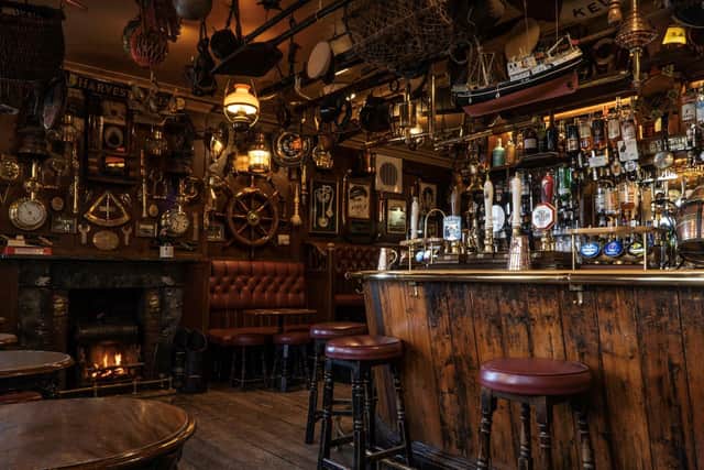 The interior of the Olde Ship Inn, which attracts visitors from all over the world.
