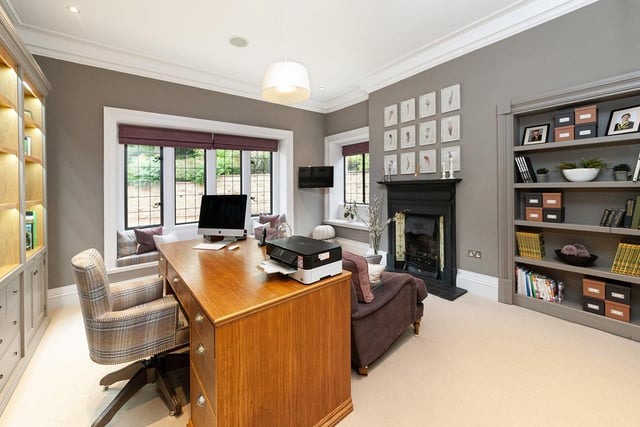 This is one of two studies that are located to the front of the property; both offer extensive shelving and storage solutions. This one benefits from dual aspect to the front and side and a quirky ‘secret’ bookcase door which leads to the garden room.
