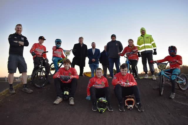Young members of Barnesbury Cycling Club, along with (from left) Martin Lynn of Barnesbury Cycling Club, Councillors Malcolm Robinson, Barry Flux and Jimmy Reith, Barnesbury Cycling Club's Mick Hood and Kyle Evans, of Clark & Kent Contractors.