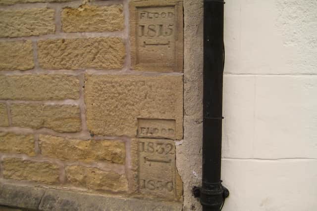 Flood marks. In 1815 the water came halfway up the height of the door.