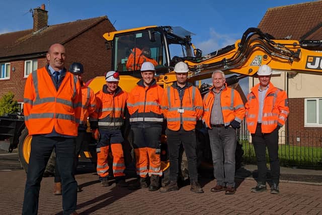 Cllr John Riddle with some of the highways team and council leader Glen Sanderson.