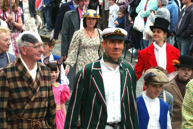 Members of Alnwick Theatre Club join the procession at the 2003 Alnwick Fair.