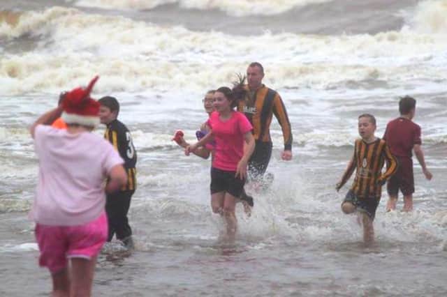 A group of participants in the 2019 Boxing Day Dip from Spittal beach.