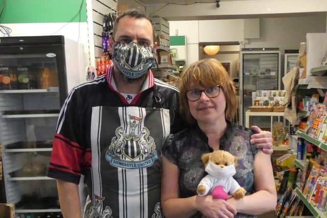 Karen and Ritchie Blake from Lowick village shop with one of the Corona teddies made by C19 stitcher Gail Hek.