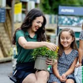 Dobbies’ colleague Ella Hanley with Ayla and Sophia Tuffaha. Picture by Joel Chant.