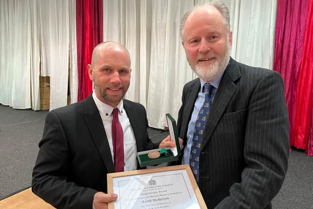 Keith Bickerton receives his award from Lord Joicey. Picture: Border Union Agricultural Society.