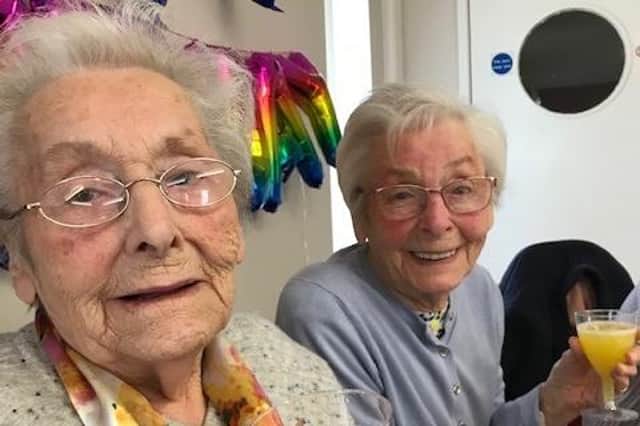 Lilian Ness (right) and her twin sister Maureen McDade celebrate their 90th birthday.