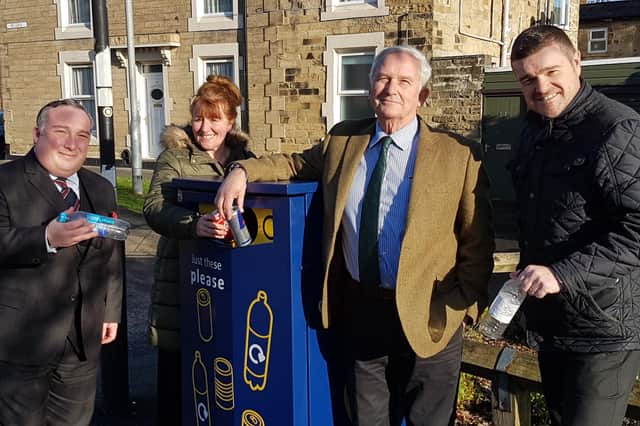 Morpeth Town and county councillors and officers with one of the new bins in Morpeth.