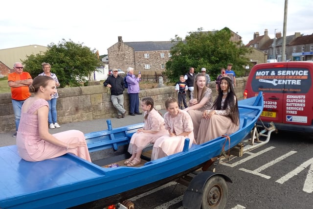 The Queen and her attendants en route to the ceremony in the coble.