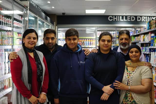 Businessman Kashmir Nijjar and his family at the Tweedmouth Costcutter store which has had a £120,000 refurbishment.