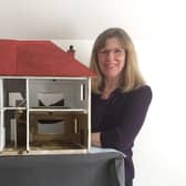Wendy Lyons with the old doll house.
