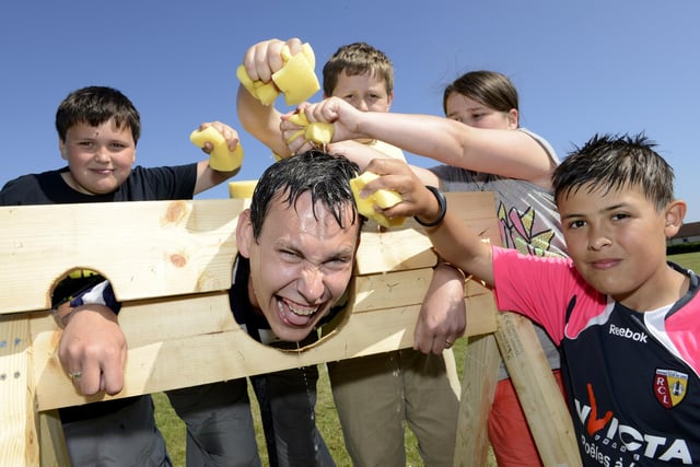 Lindisfarne Middle School fair for Aidan Jackowiak Smith. Teacher Robbie Best got soaked by pupils Nicholas Watson, James Eyres, Samantha Laing and Hayden English, in July 2013.
